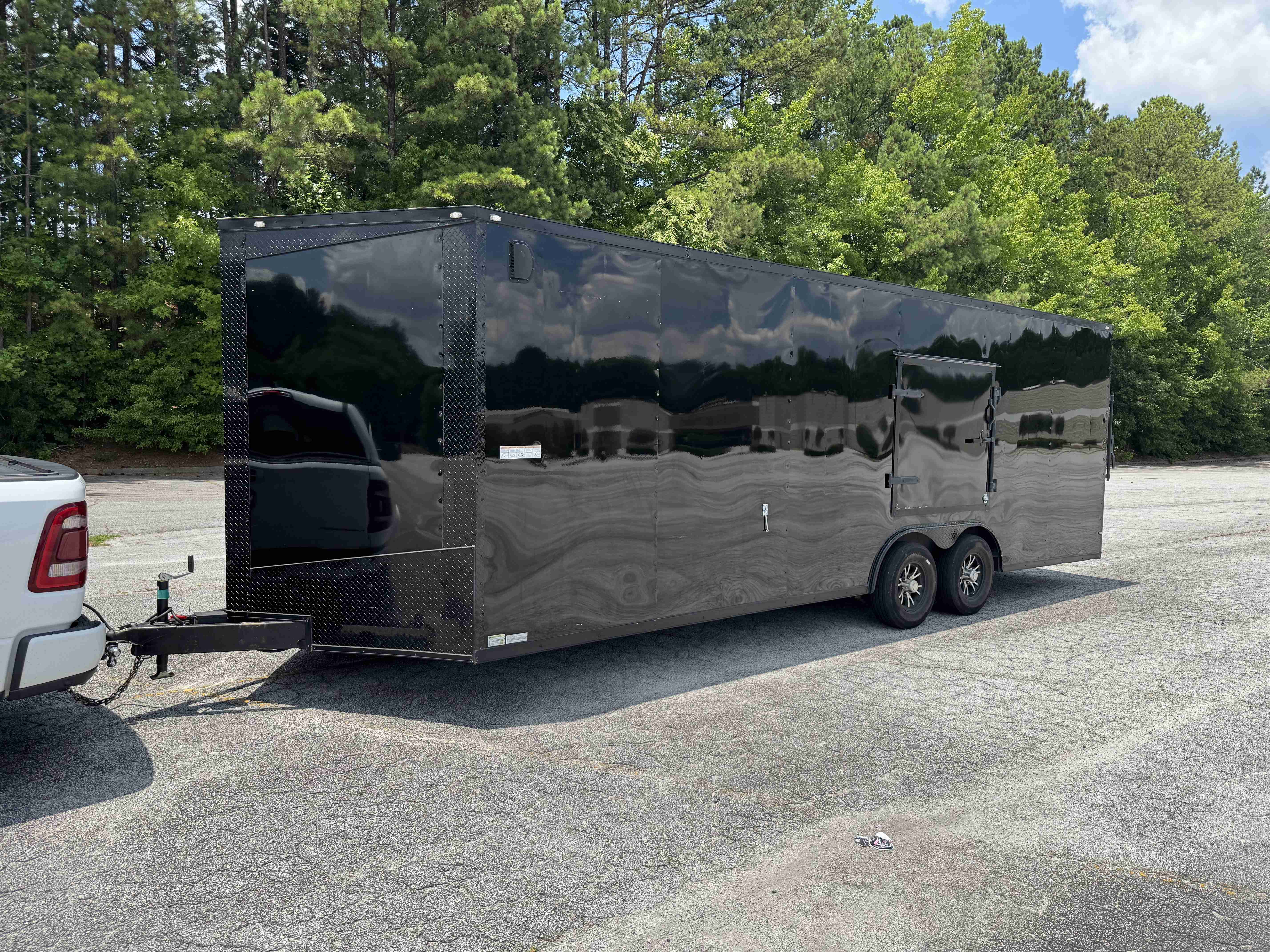 Seed Cargo 8.5x24 Enclosed Trailer rental with 7 foot ceiling height for moving and storage